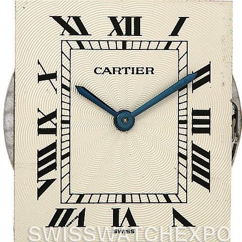 The image shows a close-up of the dial of a Cartier Tank Classic Women's Yellow Gold Silver Dial Women's Yellow Gold Silver Dial watch, featuring Roman numerals and blue hands.