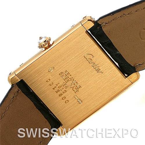 The image shows the back case and part of the straps of the Cartier Tank Classic Women's Yellow Gold Silver Dial Women's Yellow Gold Silver Dial watch at a straight angle.