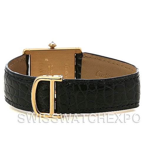 This image shows the back view of a Cartier Tank Classic Women's Yellow Gold Silver Dial Women's Yellow Gold Silver Dial watch, highlighting its black leather strap and gold buckle.