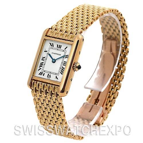 The image shows a Cartier Tank Classic Women's Yellow Gold White Dial Women's Yellow Gold White Dial watch with a gold case and bracelet, angled to display the face and part of the clasp.