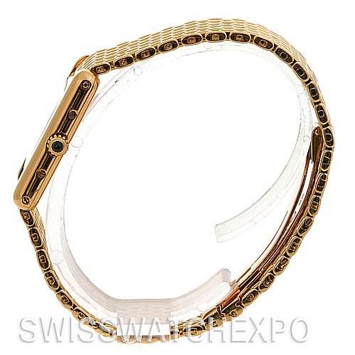 The Cartier Tank Classic Women's Yellow Gold White Dial Women's Yellow Gold White Dial watch is shown in a side view, highlighting the case and the bracelet.