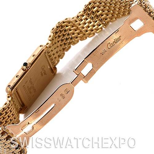 This image shows the clasp and partial bracelet of the Cartier Tank Classic Women's Yellow Gold White Dial Women's Yellow Gold White Dial watch from an angled side view.