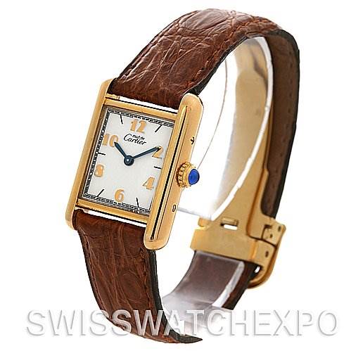 The image shows a side angled view of the Cartier Tank Classic Women's Yellow Gold White Dial Women's Yellow Gold White Dial watch, highlighting the face, crown, and brown leather strap.