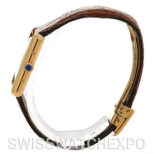 The image shows a side view of a Cartier Tank Classic Women's Yellow Gold White Dial Women's Yellow Gold White Dial watch, highlighting the case, crown, and leather strap.