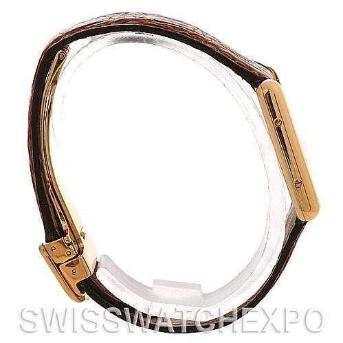 The image shows a side view of the Cartier Tank Classic Women's Yellow Gold White Dial Women's Yellow Gold White Dial model, highlighting the strap and the side profile of the case.