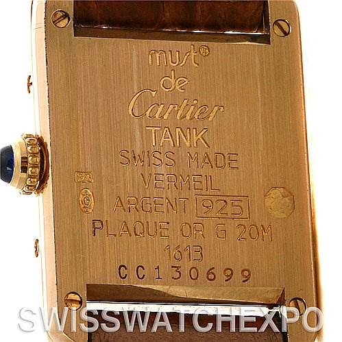 The image shows the back of a Cartier Tank Classic Women's Yellow Gold White Dial Women's Yellow Gold White Dial watch, including the engraved details and crown.