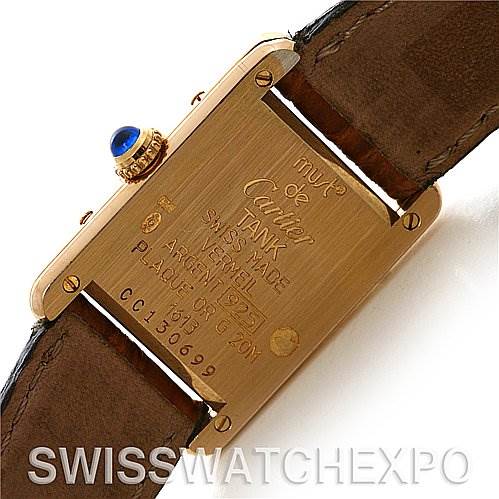 The image shows the back side of the Tank Classic watch by Cartier, highlighting the engravings and the leather strap.