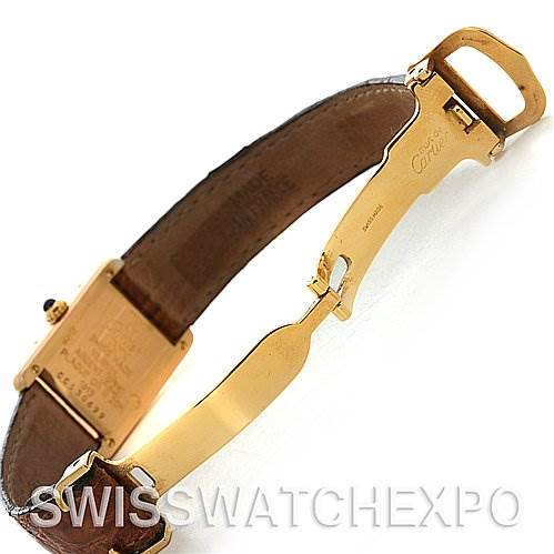 This image shows the strap, clasp, and part of the case back of the Cartier Tank Classic Women's Yellow Gold White Dial Women's Yellow Gold White Dial watch, viewed from an oblique angle.