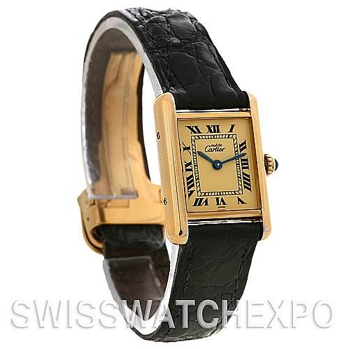 This image shows a Cartier Tank Classic Women's Yellow Gold Beige Dial Women's Yellow Gold Beige Dial watch at a three-quarter angle, highlighting its face, strap, and side profile.