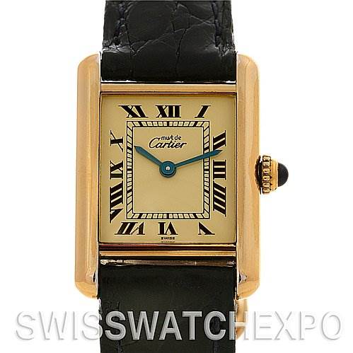 The image shows a front view of a Cartier Tank Classic Women's Yellow Gold Beige Dial Women's Yellow Gold Beige Dial watch, displaying the dial, Roman numerals, and black leather strap.