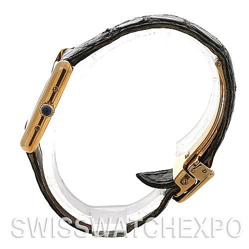 This image shows a side view of the Cartier Tank Classic Women's Yellow Gold Beige Dial Women's Yellow Gold Beige Dial model, highlighting the case, crown, and leather strap with a clasp.