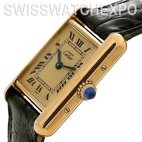 The Cartier Tank Classic Women's Yellow Gold Beige Dial Women's Yellow Gold Beige Dial watch is shown at an oblique angle, highlighting the side profile, crown, and part of the strap.