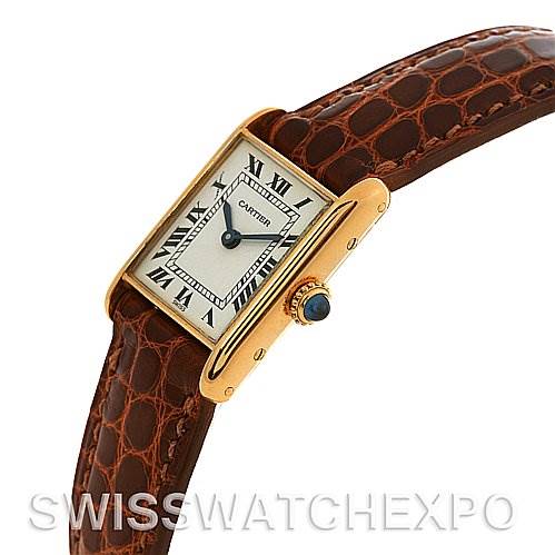 The image shows a Cartier Tank Classic Women's Yellow Gold White Dial Women's Yellow Gold White Dial model watch at a slight side angle, highlighting its face, bezel, crown, and leather strap.