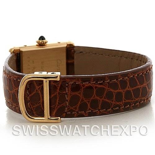 The image shows the Cartier Tank Classic Women's Yellow Gold White Dial Women's Yellow Gold White Dial watch from an angled rear view, highlighting its brown leather strap and gold clasp.