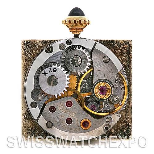 This image shows the internal mechanism of a Cartier Tank Classic Women's Yellow Gold White Dial Women's Yellow Gold White Dial watch from a top-down angle.