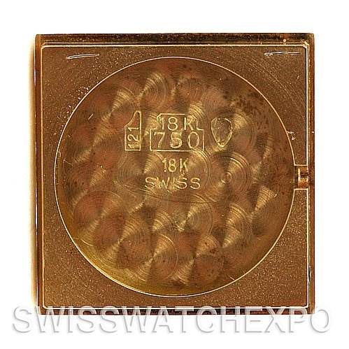 This image shows the back case of the Tank Classic model by Cartier, highlighting its 18K gold marking.