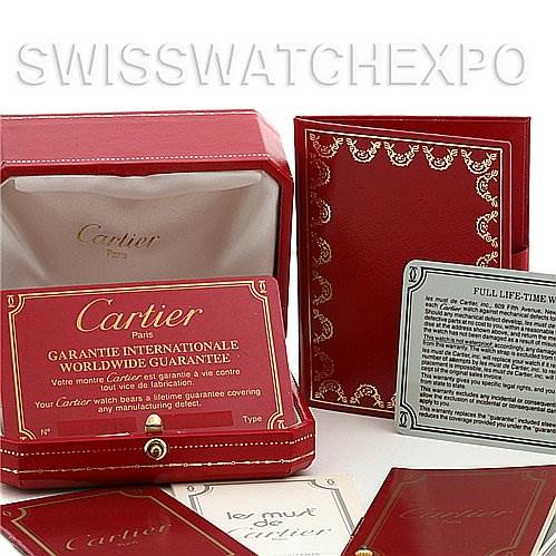 The image shows the packaging, warranty card, and documents for the Cartier Tank Classic Women's Yellow Gold White Dial Women's Yellow Gold White Dial watch from an overhead angle.