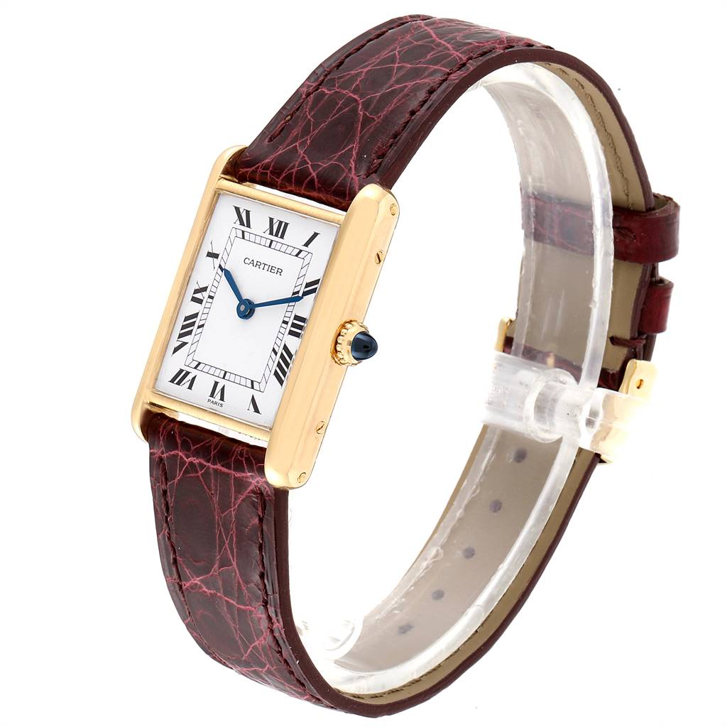 The Cartier Tank Classic Women's Yellow Gold White Dial Women's Yellow Gold White Dial watch is shown at an angled view, displaying the face, crown, and leather strap.
