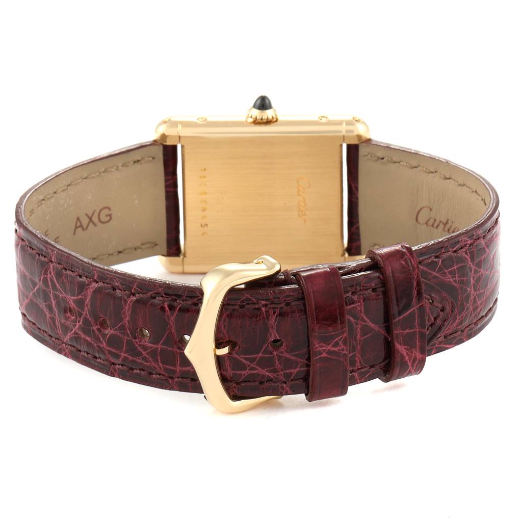 The image shows the back view of the Cartier Tank Classic Women's Yellow Gold White Dial Women's Yellow Gold White Dial watch, highlighting the clasp and strap.