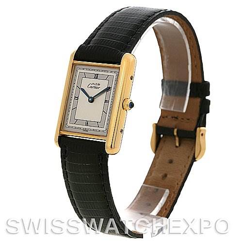 The image shows a side angle of a Cartier Tank Classic Yellow Gold Silver Dial Yellow Gold Silver Dial watch highlighting its face, case, crown, and black leather strap.
