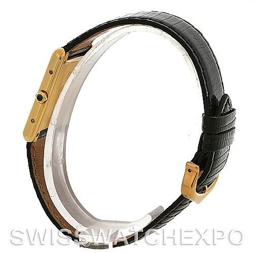 The image shows a side view of the Cartier Tank Classic Yellow Gold Silver Dial Yellow Gold Silver Dial watch, highlighting its strap, buckle, and side profile with the crown detail.