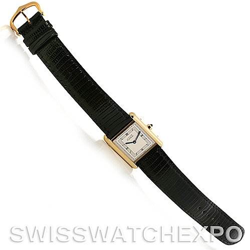 The Cartier Tank Classic Yellow Gold Silver Dial Yellow Gold Silver Dial watch is shown from a top-down angle, displaying the face, case, and full leather strap.