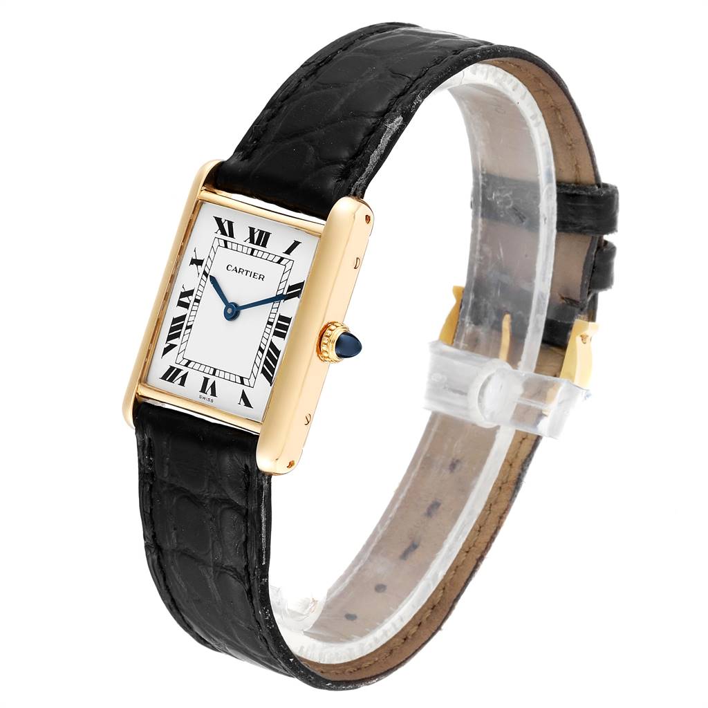The Cartier Tank Classic Women's Yellow Gold White Dial Women's Yellow Gold White Dial watch is shown from an angled side view, displaying the face, black leather strap, and gold case.