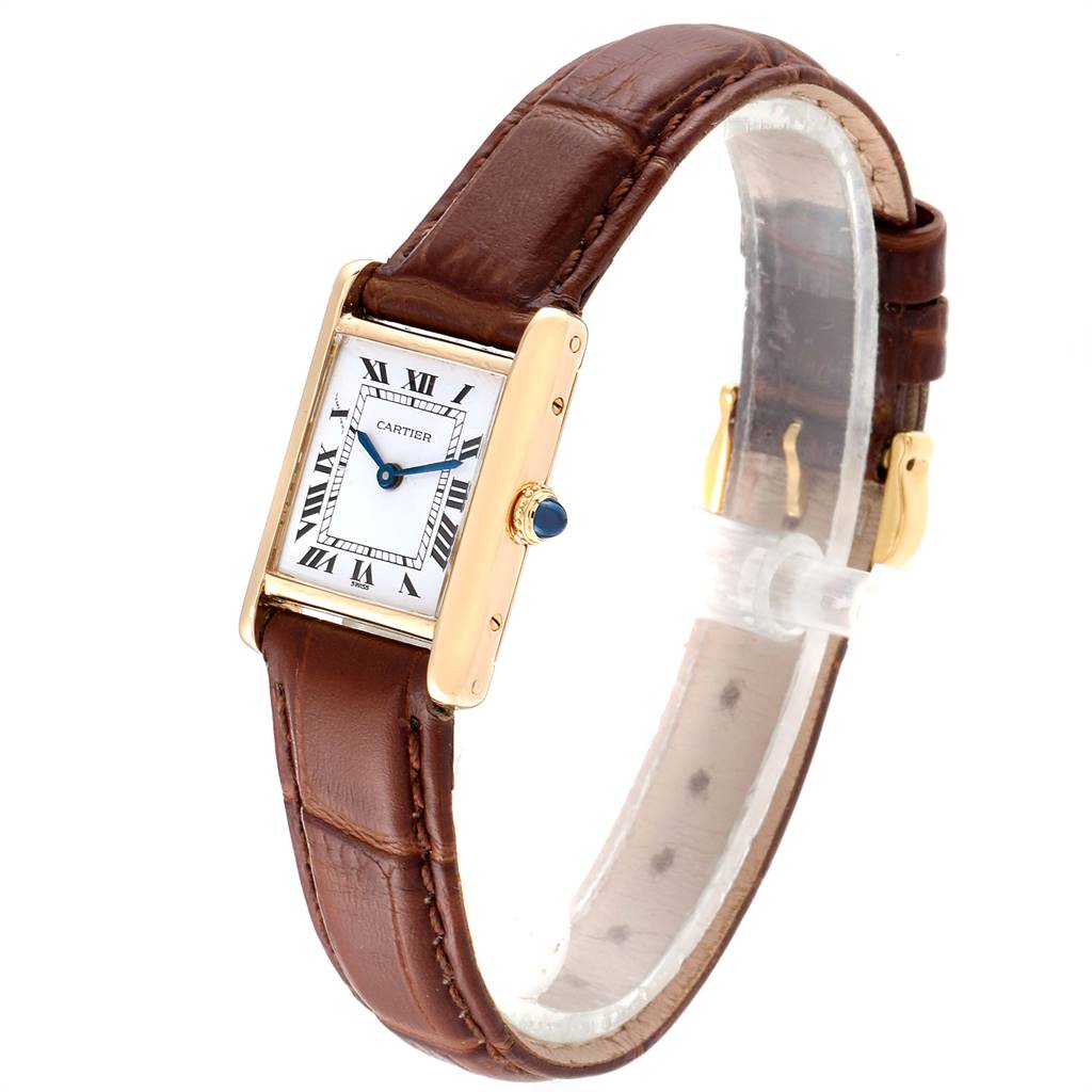 The Cartier Tank Classic Women's Yellow Gold White Dial Women's Yellow Gold White Dial watch is shown at a slight angle, highlighting the face, leather strap, and gold casing.