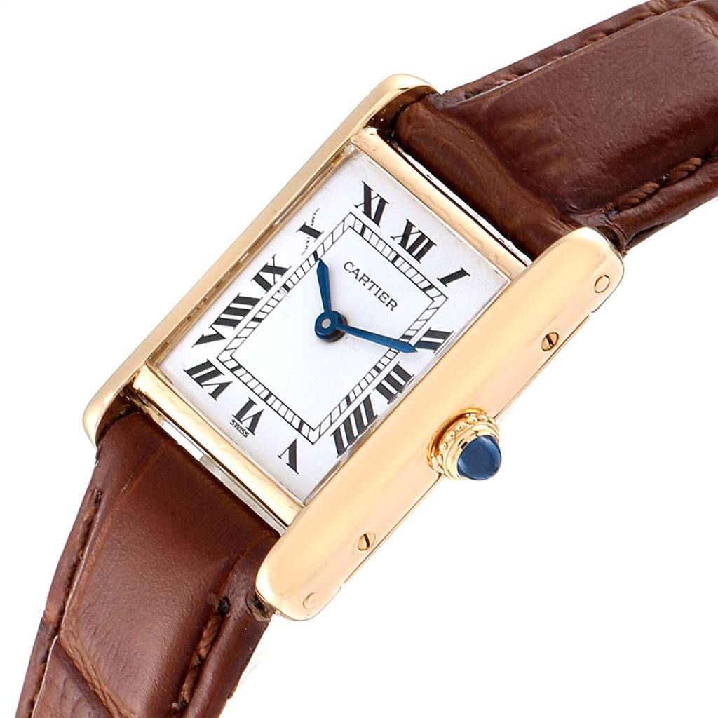 The Cartier Tank Classic Women's Yellow Gold White Dial Women's Yellow Gold White Dial watch is shown at a slight angle, displaying the face, bezel, crown, and part of the leather strap.