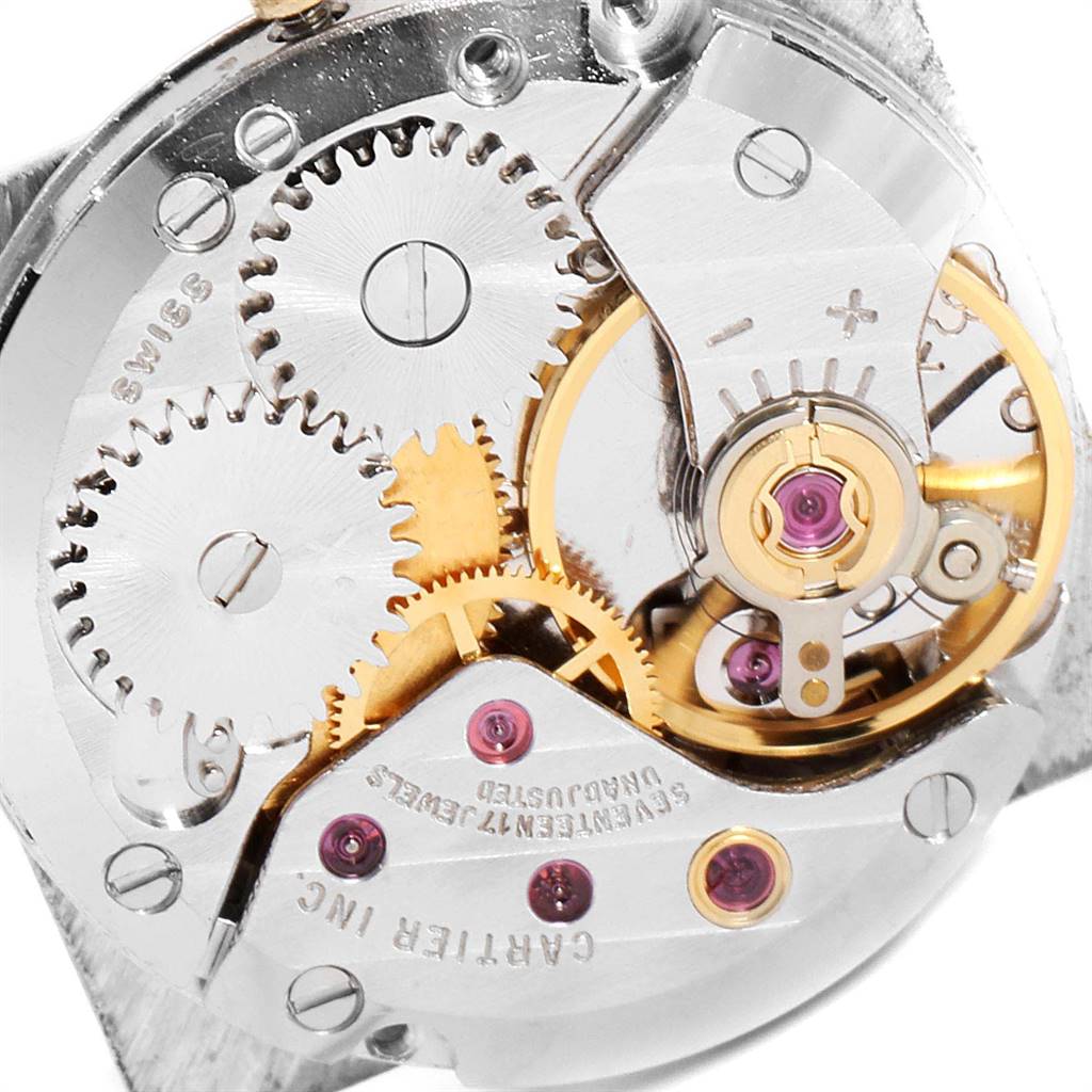 This image shows a detailed close-up of the mechanical movement inside a Cartier Tank Classic Women's Yellow Gold White Dial Women's Yellow Gold White Dial watch.
