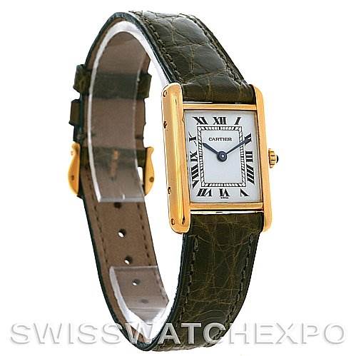 The image shows the Cartier Tank Classic Women's Yellow Gold White Dial Women's Yellow Gold White Dial watch from an angled front view, highlighting the dial, gold case, and leather strap.
