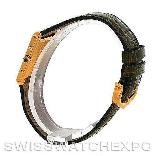 The image shows a side view of a Cartier Tank Classic Women's Yellow Gold White Dial Women's Yellow Gold White Dial watch, highlighting its gold case, black leather strap, and buckle.