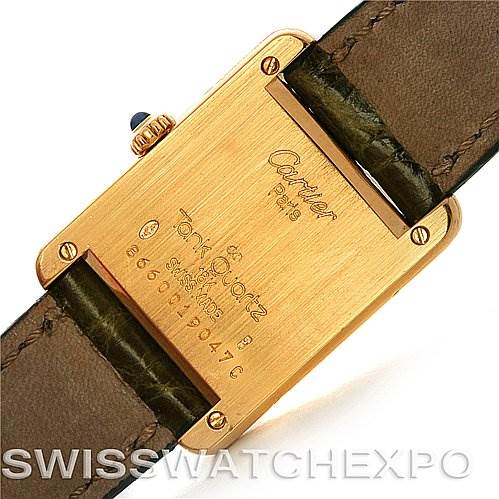 The image shows the back of a Cartier Tank Classic Women's Yellow Gold White Dial Women's Yellow Gold White Dial watch, displaying the case back, screws, and strap attachment.