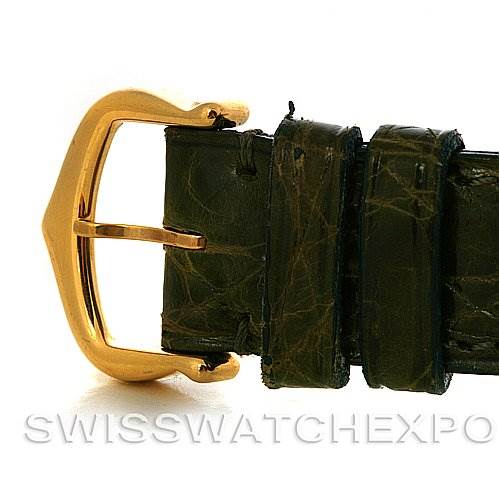 The image shows a close-up of the buckle and strap of a Cartier Tank Classic Women's Yellow Gold White Dial Women's Yellow Gold White Dial watch.