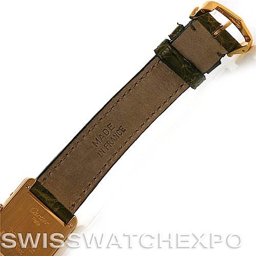 This image shows a top-down view of the leather strap and buckle of a Cartier Tank Classic Women's Yellow Gold White Dial Women's Yellow Gold White Dial watch.