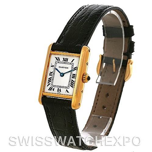 This image shows a Cartier Tank Classic Women's Yellow Gold White Dial Women's Yellow Gold White Dial watch from an angled side view, highlighting the face, strap, and buckle.