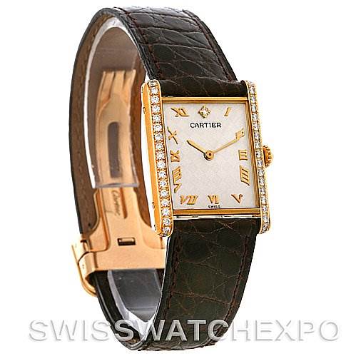 The image shows a Cartier Tank Classic C70934 Yellow Gold Silver Dial C70934 Yellow Gold Silver Dial model watch angled from the front and left side, highlighting its face, strap, and clasp.
