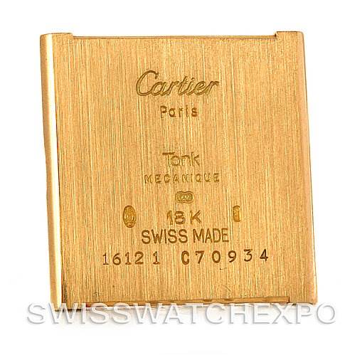 The image shows the back plate of a Cartier Tank Classic C70934 Yellow Gold Silver Dial C70934 Yellow Gold Silver Dial watch, highlighting its 18K gold composition and Swiss origin.