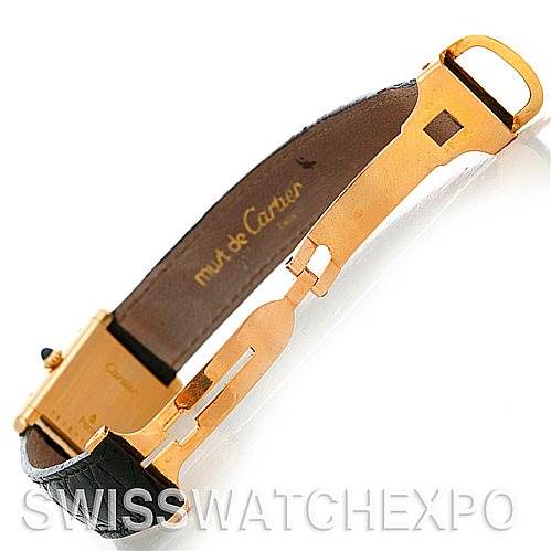 The image shows a partially opened Tank Classic model by Cartier from a side angle, highlighting the clasp and part of the leather strap.