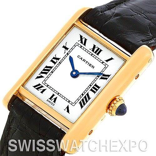 This image shows a close-up angle of the Cartier Tank Classic Women's Yellow Gold White Dial Women's Yellow Gold White Dial watch face and part of the leather strap.