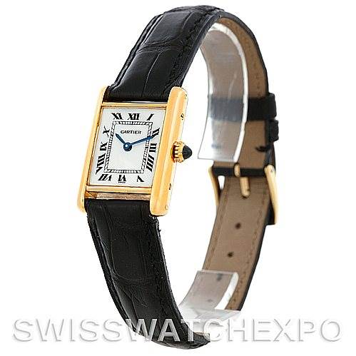 The image shows a Cartier Tank Classic Women's Yellow Gold White Dial Women's Yellow Gold White Dial watch from an angled side view, highlighting its rectangular dial, gold case, and black leather strap.