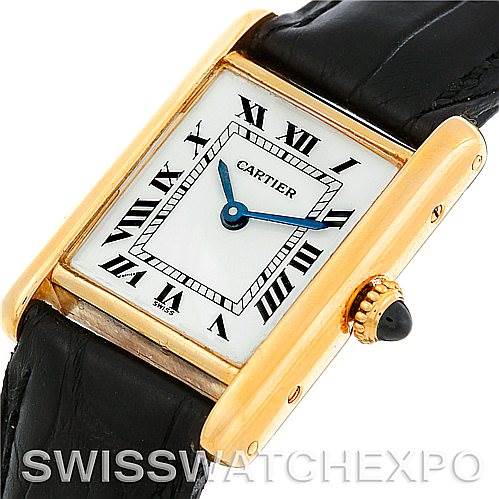 The image shows a close-up angle of the Cartier Tank Classic Women's Yellow Gold White Dial Women's Yellow Gold White Dial model watch, highlighting the face, crown, and strap.