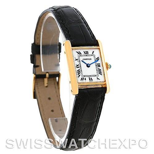 The image shows a side angle of the Cartier Tank Classic Women's Yellow Gold White Dial Women's Yellow Gold White Dial watch, highlighting its face, gold case, and black leather strap.