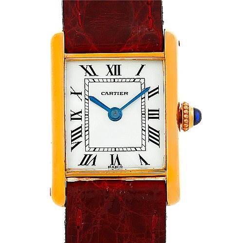 The image shows a front view of a Cartier Tank Classic Women's Yellow Gold White Dial Women's Yellow Gold White Dial watch, highlighting the dial, Roman numerals, and leather strap.