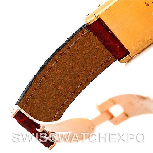 The image shows a close-up of the brown leather strap and clasps of a Cartier Tank Classic Women's Yellow Gold White Dial Women's Yellow Gold White Dial wristwatch.