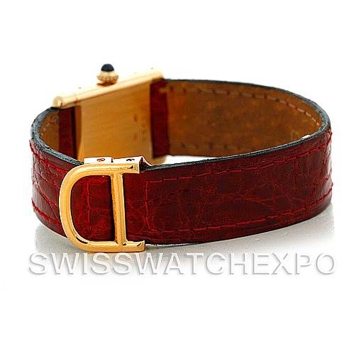 The image shows the back view of a Cartier Tank Classic Women's Yellow Gold White Dial Women's Yellow Gold White Dial watch with a red leather strap and gold buckle.