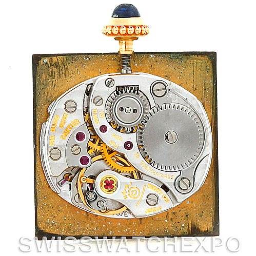 This image shows the movement mechanism of a Cartier Tank Classic Women's Yellow Gold White Dial Women's Yellow Gold White Dial watch from a top-down angle.