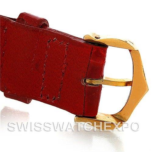 The image shows a close-up of the gold buckle and red leather strap of the Cartier Tank Classic Women's Yellow Gold White Dial Women's Yellow Gold White Dial model watch.