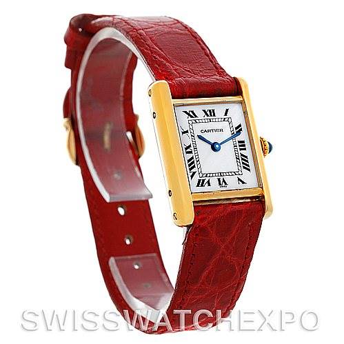 The image shows a Cartier Tank Classic Women's Yellow Gold White Dial Women's Yellow Gold White Dial watch from a three-quarter angle, highlighting its red leather strap and gold case.