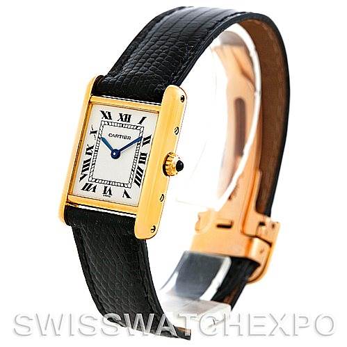 The image shows a Cartier Tank Classic Women's Yellow Gold Silver Dial Women's Yellow Gold Silver Dial watch with a gold rectangular case, black leather strap, and white dial with Roman numerals at an angled view.